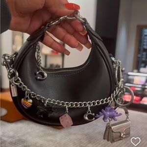 Jonie bag Black coach bag small 
Does not come with charms